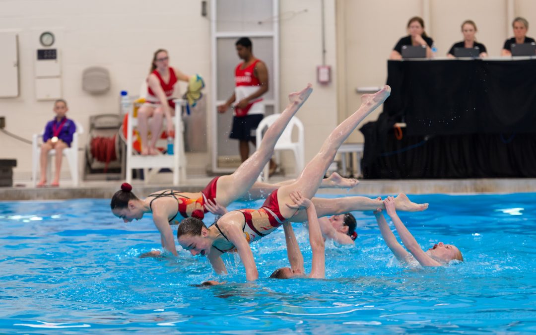artistic swimming team performing highlights