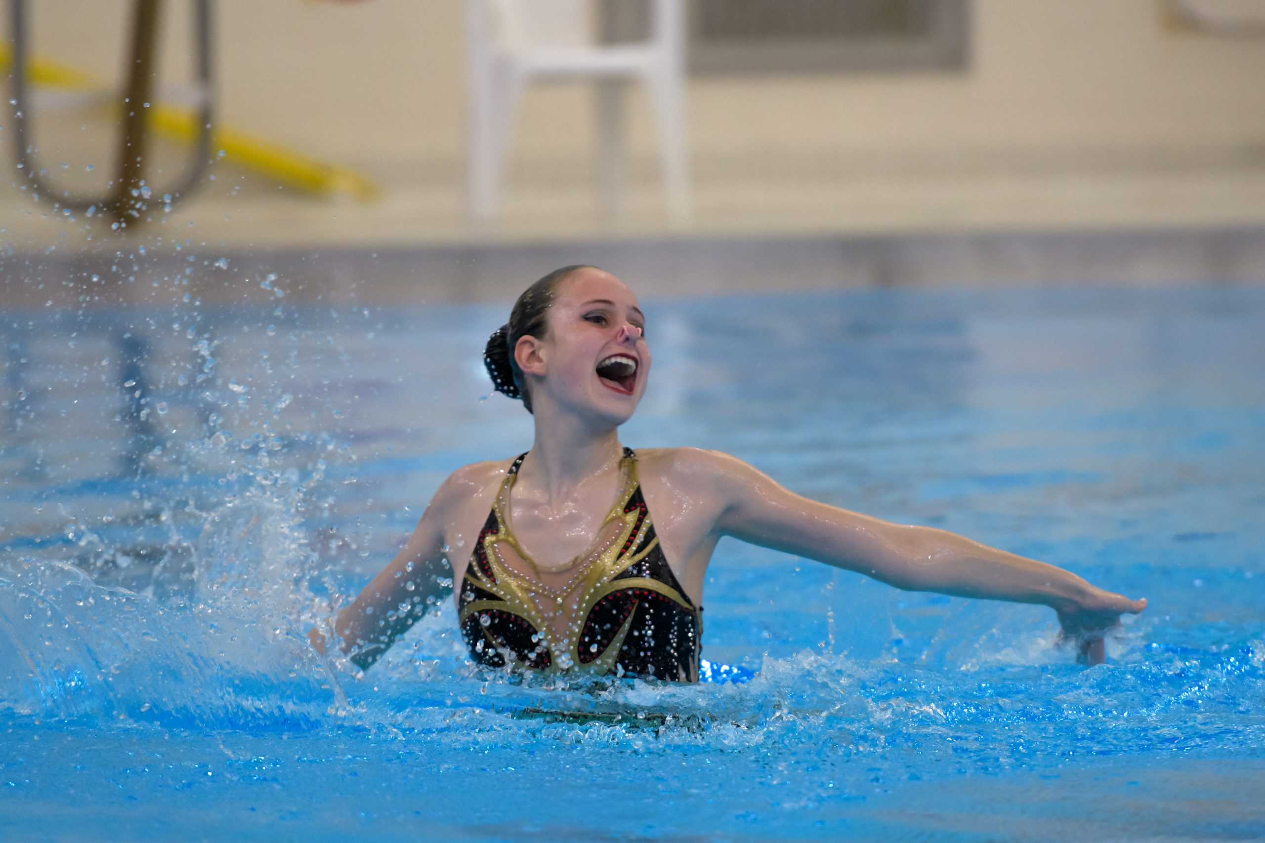 artistic swimmer splashing the water